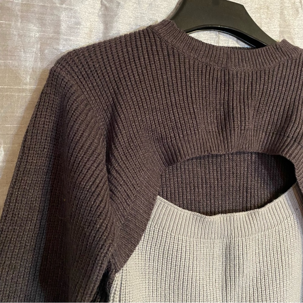 Color block lt gray/charcoal sweater with sexy cutout, size M, has tiny snag
